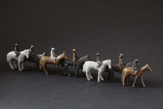Racehorses and jockeys on way to the start gate-bronze miniature